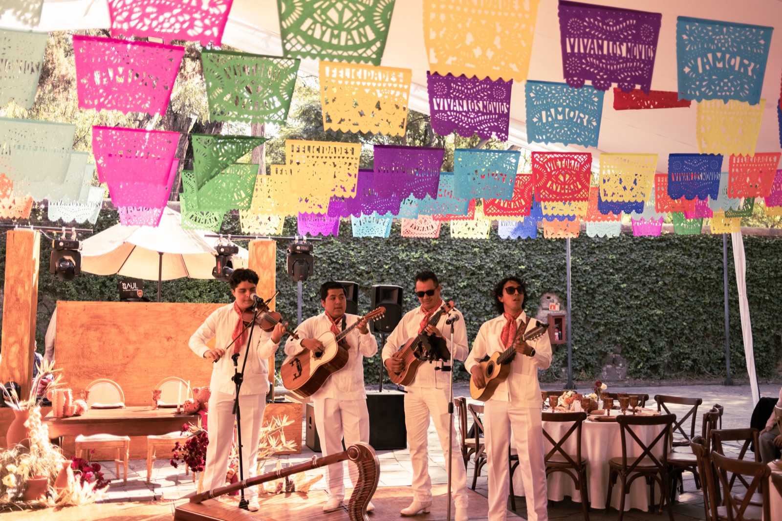 A mariachi band beneath papel picado banners, Mexico
